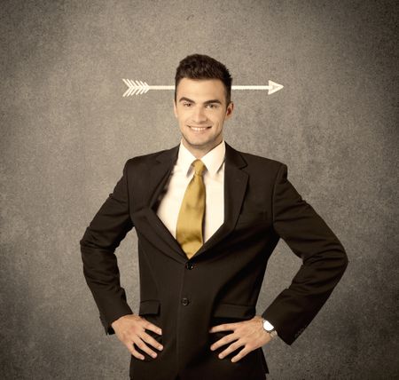 A confused young business guy giving thumbs up with a drawn arrow going through his head concept