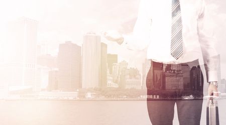 businessman-standing-cityscape-background-warm-light-603592016 Businessman standing at cityscape background with warm light