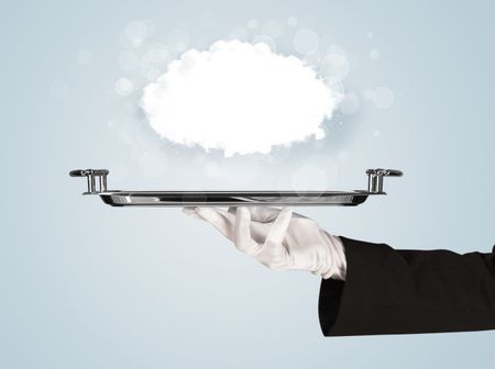 An elegant waiter business hand in white glove holding a plate with empty clear cloud in front of blue gradient background.