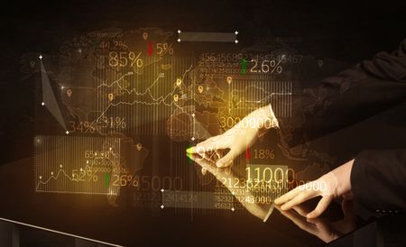 Hands navigate on high tech smart table with business icons and symbols