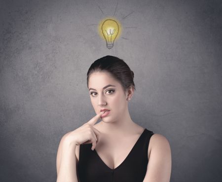 teen-student-girl-funny-facial-expression-603627617 A teen student girl with funny facial expression has a good idea illustrated by a drawn light bulb lighting up above the head on the grey wall background concept.