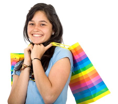 happy girl smiling holding shopping bags - isolated over a white background