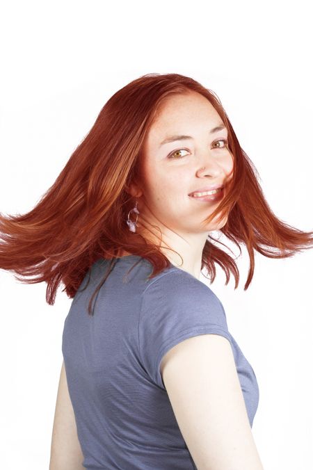 Beautiful woman with coloured hair in movement over a white background