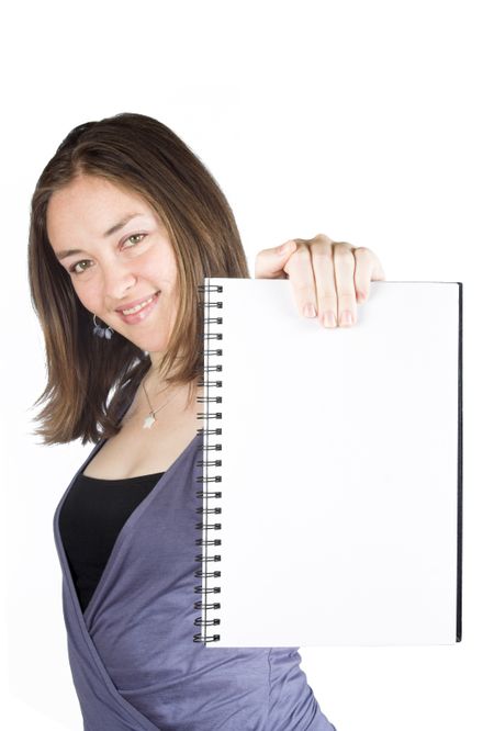 Beautiful woman holding a blank notebook over a white background