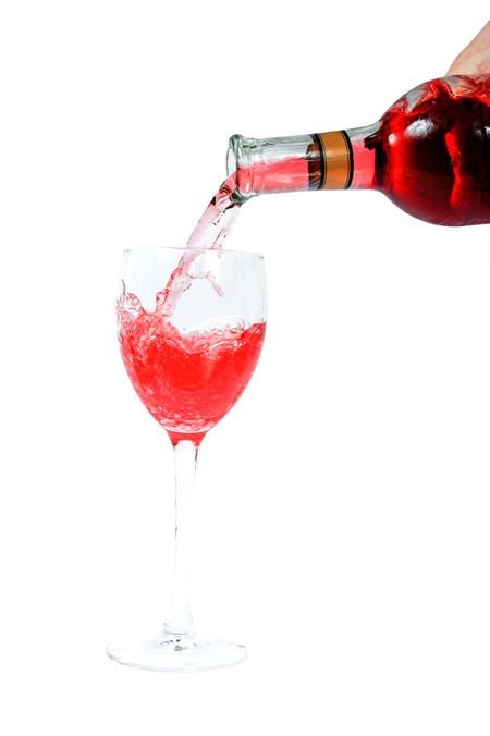 Pouring red wine over a white background