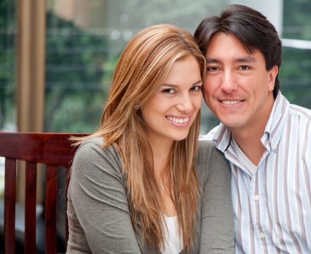 Beautiful loving couple portrait at home smiling