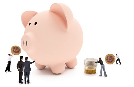 Business people putting savings in a piggybank - isolated over a white background
