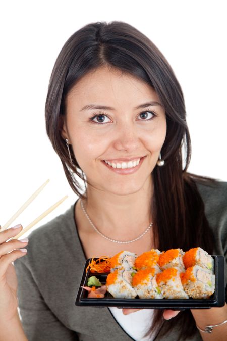 Woman eating sushi and smiling - isolated over a white background