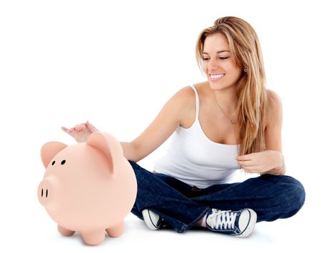 Woman stroking a piggybank - isolated over a white background