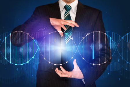 Businessman with DNA concept in his hands 