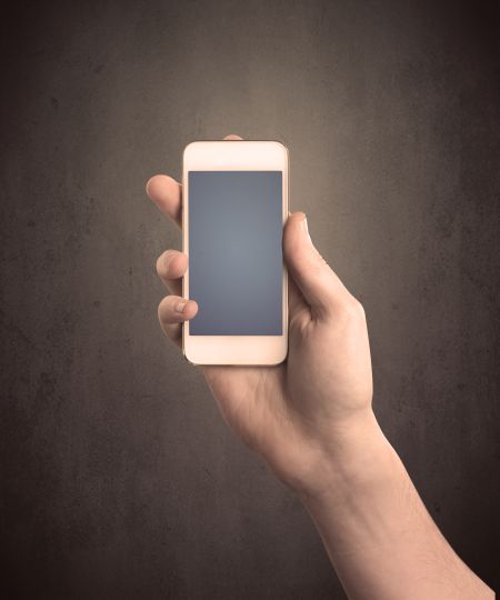 caucasian-hand-business-suit-holding-blank-608678651 Caucasian hand in business suit holding a blank screen smartphone