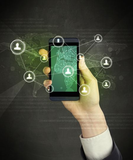 Caucasian hand in business suit holding a smartphone, social network concept