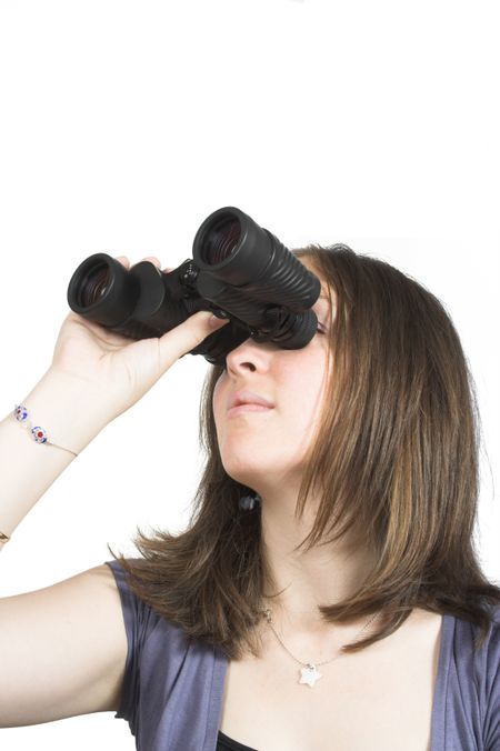 beautiful girl searching for something with binoculars