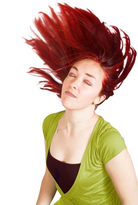 attractive girl moving her beautiful red hair around - focus on face, shallow depth of field