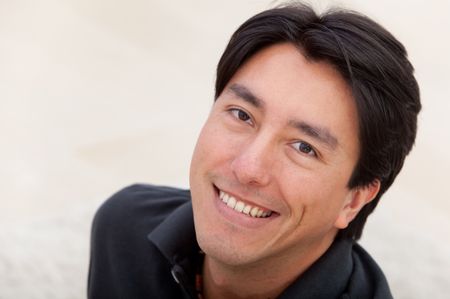 Portrait of a handsome male smiling indoors