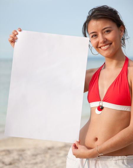 Woman in bikini at the beach holding a banner ad