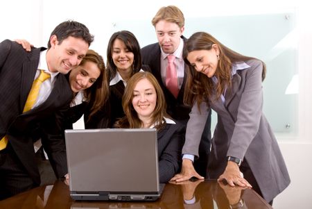 business team in an office laptop computer - meeting