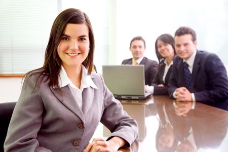 business team with a businesswoman leading it in a corporate environment