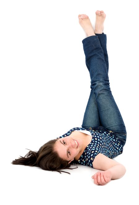 Casual woman portrait on the floor with legs up over a white background