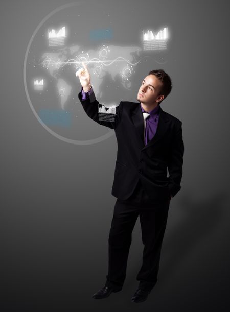 Businessman pressing high tech type of modern buttons on a virtual background