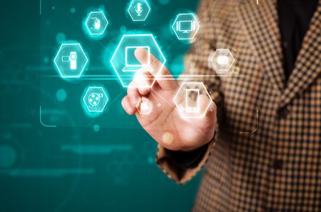 Young businessman pressing virtual media type of buttons