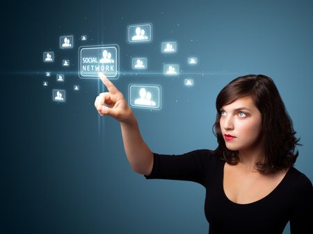 Businesswoman pressing modern social buttons on a virtual background