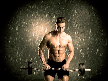 handsome-young-body-builder-weightlifting-showing-613313354 A handsome young body builder weightlifting while showing his muscular upper body in the rain concept