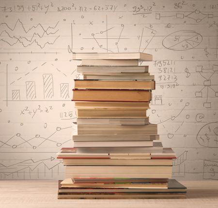 A pile of books with math formulas written in doodle style on background
