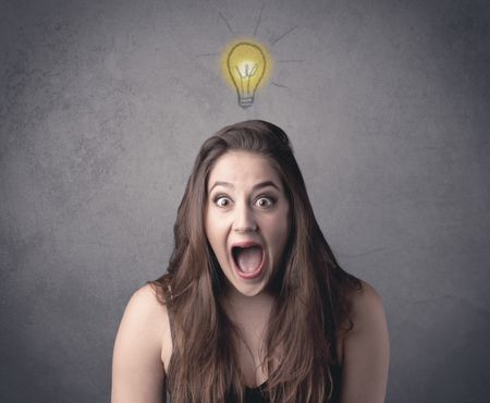 teen-student-girl-funny-facial-expression-613370588 A teen student girl with funny facial expression has a good idea illustrated by a drawn light bulb lighting up above the head on the grey wall background concept.