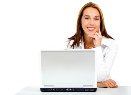 Business woman on a laptop computer in her desk isolated over a white background