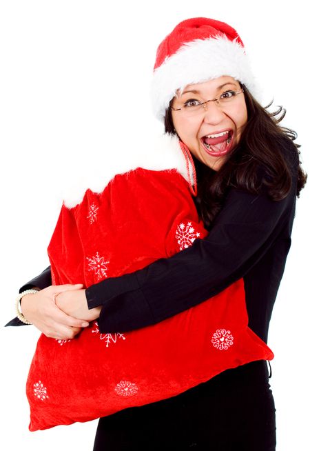 happy female santa with lots of gifts in a red sack isolated over a white background