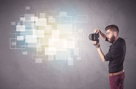 A funny stylish hipster guy capturing bright moments and glowing square pictures with a vintage photo camera illustration concept