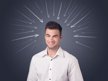 Young casual businessman with arrows pointing to his head