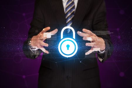 Businessman with security concept in his hands 