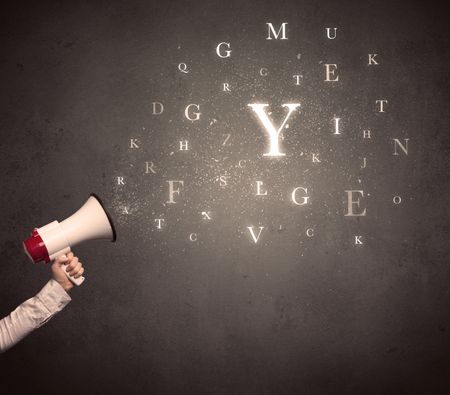 Caucasian arm holding megaphone with letter cloud