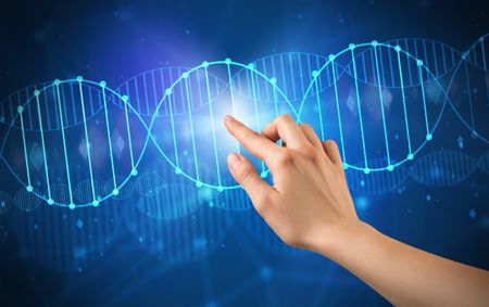 Female hand touching DNA molecule with blue background