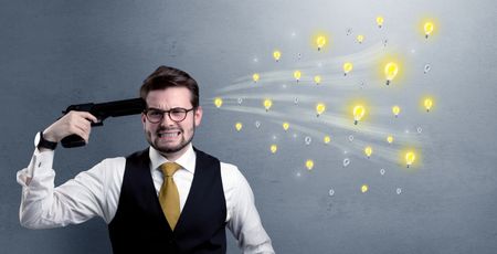 Man shoots his head with gun and idea bulbs are coming out from his head
