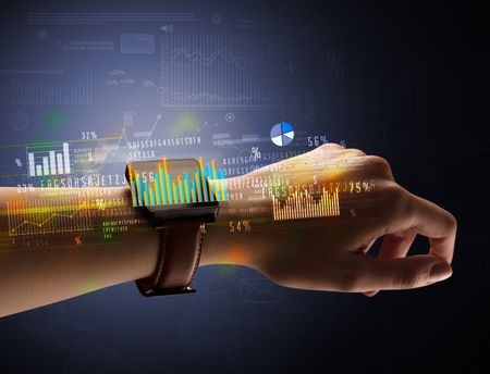 Cloe up naked female hand with smartwatch with financial symbols around