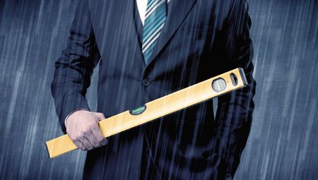 Young handsome  man holding tool with raindrop graphic