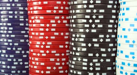 abstract background with casino chips of four different colours
