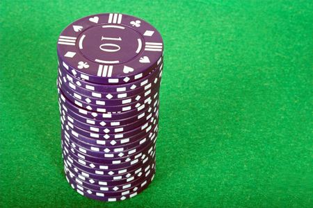 blue pile of casino chips over a green background