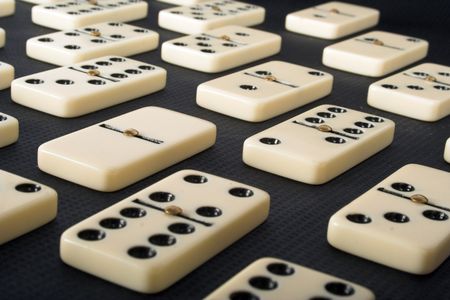dominoes over a black background
