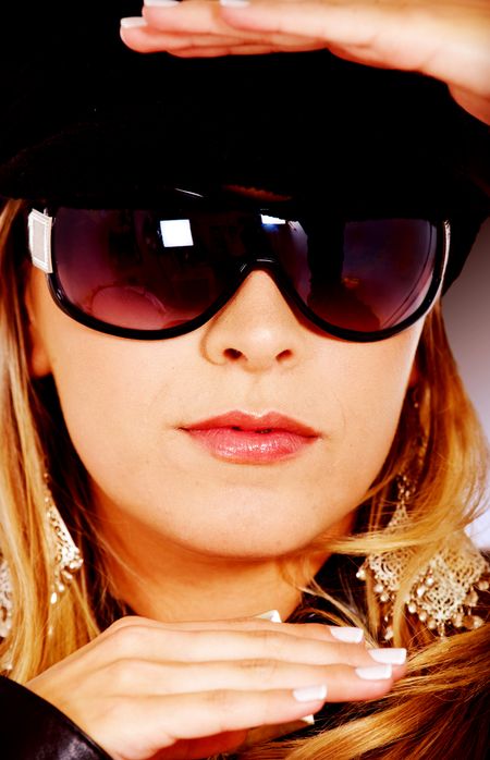 face of fashion girl framing her head with her hands