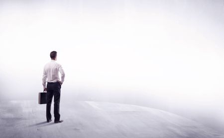 Young sales businessman in elegant suit standing with his back in empty white space background concept