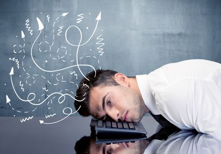 A depressed businessman resting his head on a keyboard and shouting with illustration of ideas, arrows, lines leaving his head concept