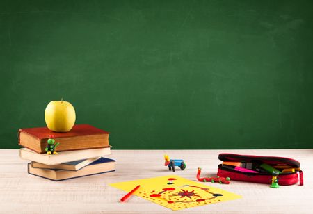 Back to school concepty with clear blackboard background, desk, items