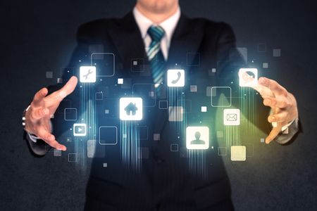 Blue social application icons in the hands of a businessman 