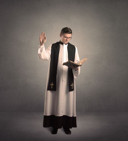 young priest in giving his blessing