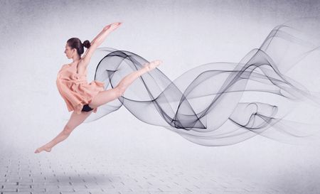 Modern ballet dancer performing with abstract swirl concept on background