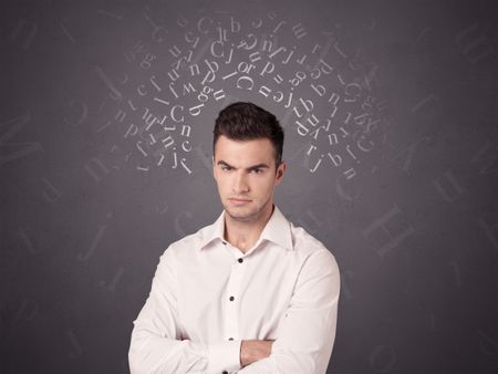 Young casual businessman with white alphabet around his head